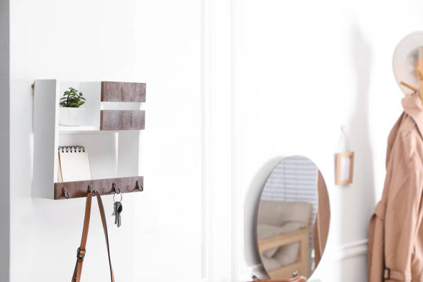 istock Wooden key holder on white wall in hallway 1415168218