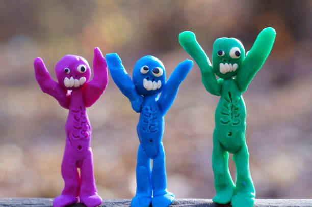 istock Figures of three happy zombies in close-up. 1415169030