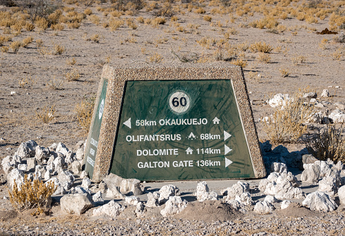Road Sign to Okaukuejo at Etosha National Park in Kunene Region, Namibia