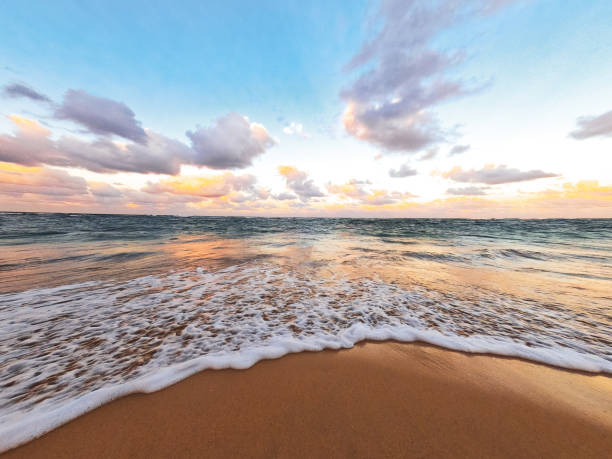istock Sand beach background seaside with foamy sea wave 1415170202