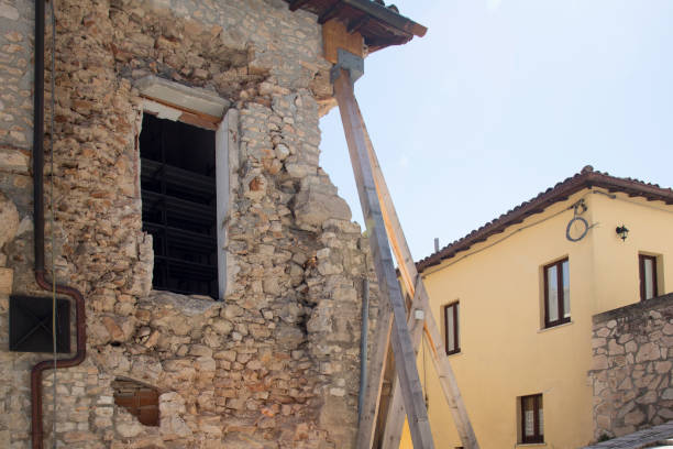 ancient window with arch and green shutters