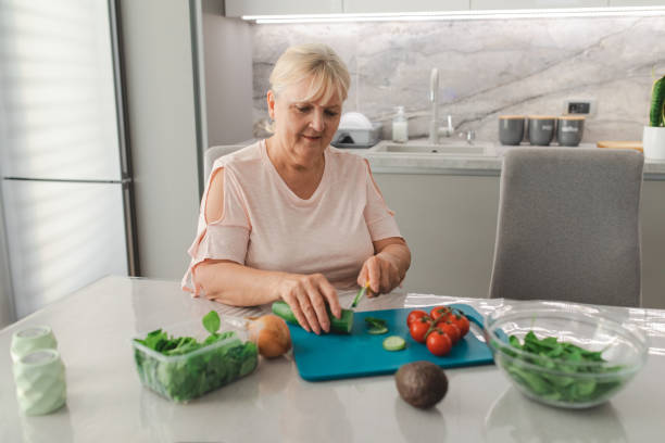 istock Woman Preparing a Healthy Salad 1415171627