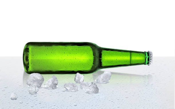 istock Beer bottle with water drops and ice cubes on white background 1415172049