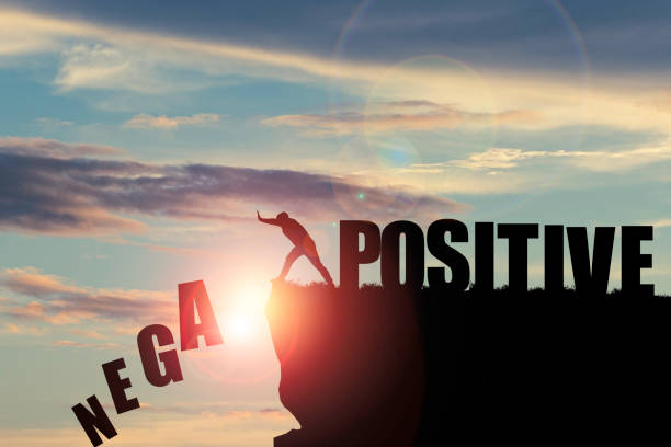 istock Silhouette man pushing to change wording from negative to positive for mindset concept. 1415172130