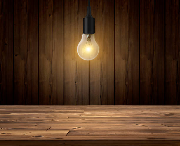 Old and Energy Efficient Light Bulbs on blue background