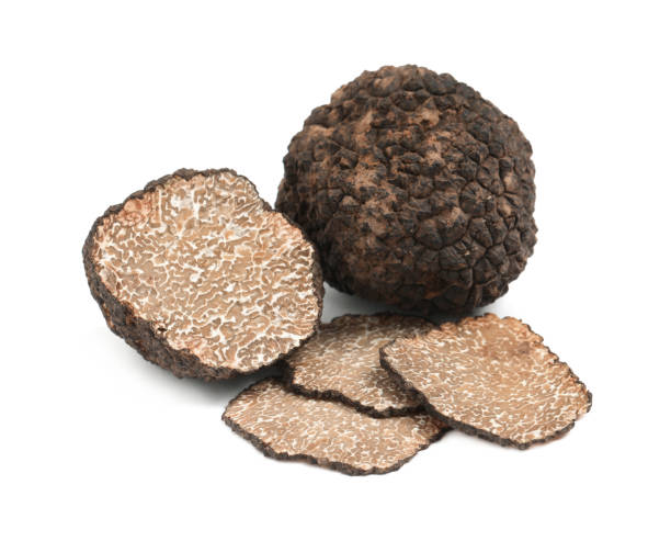 istock Cut and whole black truffles isolated on white 1415173076