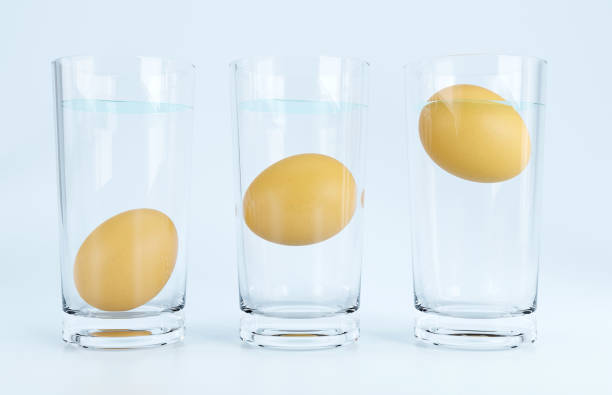 istock Eggs in water test on transparent glass , Egg freshness test on white background, 3d Rendering 1415177141
