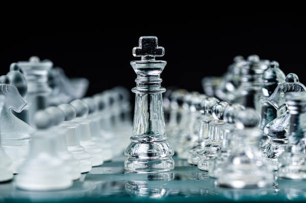 istock Transparent glass chess pieces on dark background. Leadership and  strategy concept, selective focus 1415178391