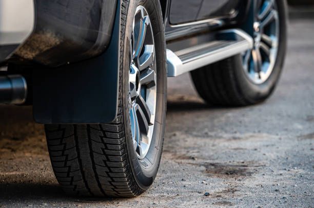 istock Closeup of parked car on a city street side 1415183473
