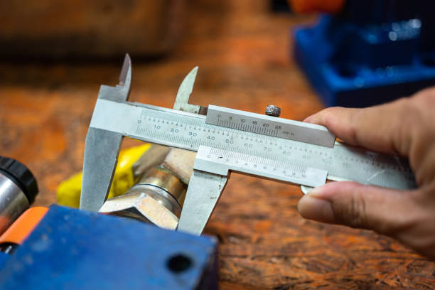 istock Using Vernier caliper to measuring the machinery part. 1415183801