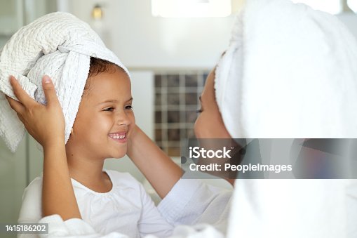 istock Hygiene, washing hair and grooming with haircare routine for a mother and daughter home spa day. Happy, caring and sweet child and parent bonding over healthy skincare or relaxing pampering treatment 1415186202