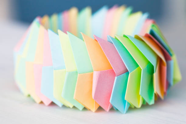 A close-up shot of a colorful origami structure made up of flower elements