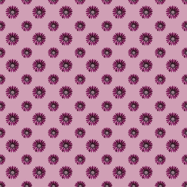 Seamless pattern with purple bright flowers on a pink  background. Textile fabric design. Design for textiles.