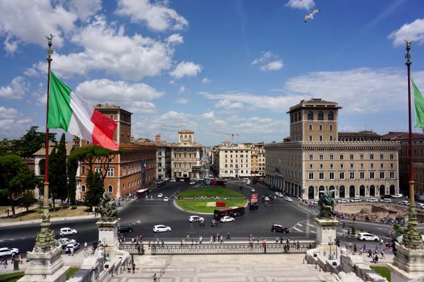 istock Piazza Venezia is a central hub of Rome, Italy, in which several thoroughfares intersect, including the Via dei Fori Imperiali and the Via del Corso 1415189370
