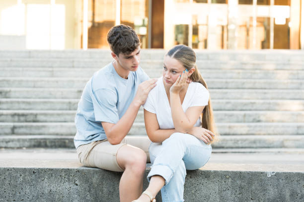 istock Teenager boy consoling sad girlfriend 1415191831