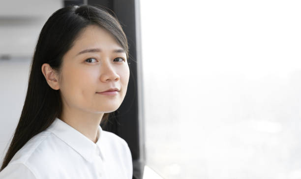 istock Asian woman in white shirt 1415192056