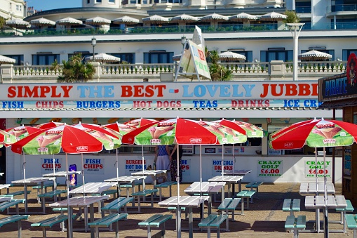 Lovely Jubbly Chip Shop on Brighton Beach on a sunny day, Brighton 13 August 2022. Brighton is a seaside resort and one of the two main areas of the City of Brighton and Hove in the county of East Sussex, England. Brighton is 47 miles south of London.