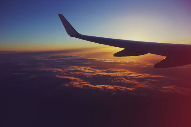 istock View from an airplane in the sky at sunset 1415196580