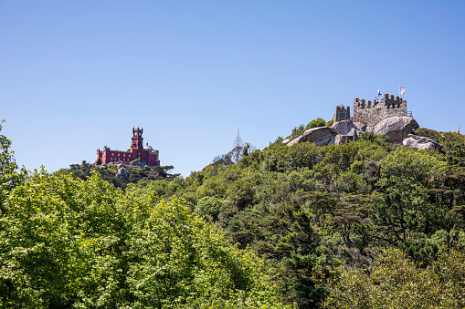 May 26, 2022, Sintra Mountain, Sintra, Lisboa, Portugal: A view from an adjacent hill of the Moorish Castle with Pena Palace in the distance, on a pleasant, Sunny, spring day.