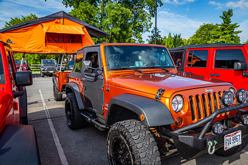Pigeon Forge, TN - August 25, 2017: Modified Jeep Wrangler Sport JK Hardtop with a rooftop tent at a local enthusiast rally.