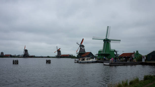 istock Windmill town and its lake in Netherlands 1415198525