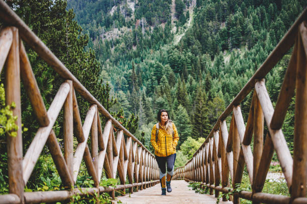 Female hiker walking on staircase in nature