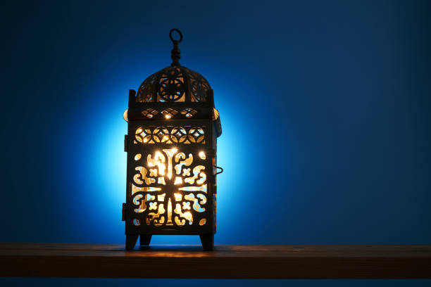 close up of arabic lantern against blue background
