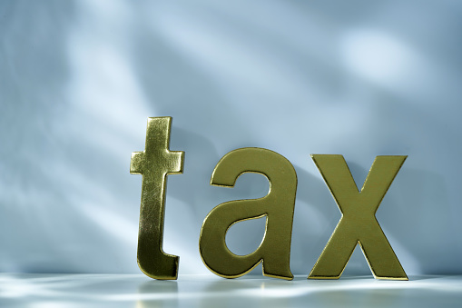 single  word tax with gray background