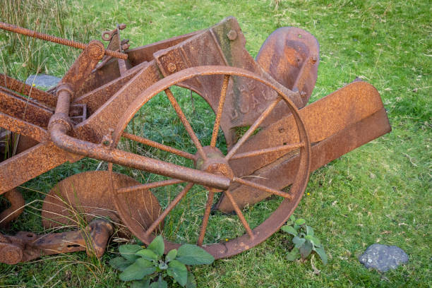istock Old Rusty Plough in a Field, Ireland 1415203574
