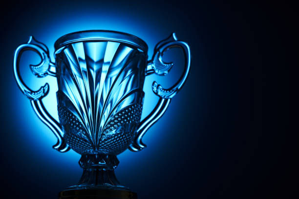 light on the crystal trophy against blue background