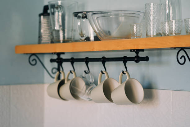 kitchen-open-wooden-shelf-with-dishes-glasses-and-mugs-mugs-are-hanging-from-hooks-cozy, Kitchen Renovation, Bathroom Renovation, House Renovation Auckland