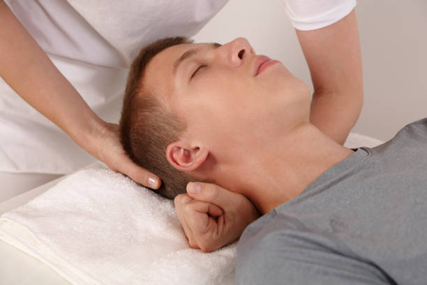 istock Craniosacral therapy for adolescent. Holistic approach Alternative Medicine concept 1415209616