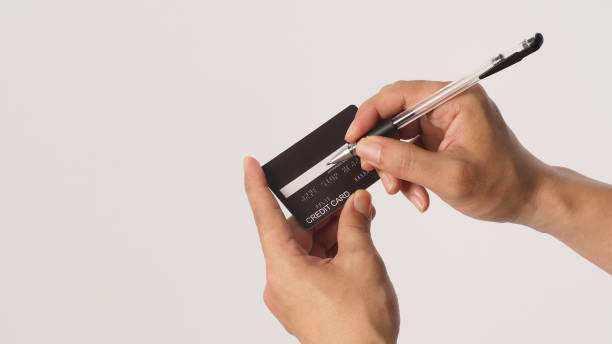 istock Hands is sign black credit card on white background 1415209647