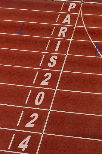 finish line running track stadium with title Paris 2024