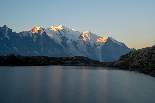 The Mont Blanc Massif reflection into cheserys lake at sunrise - France