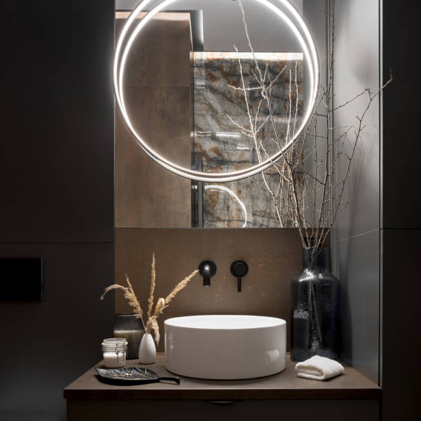 istock Elegant, round led lamp in modern bathroom, close-up 1415211503