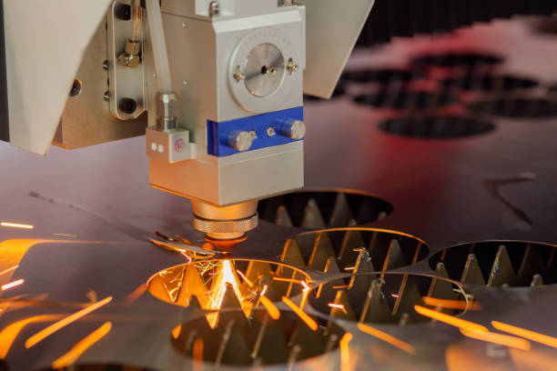 istock CNC laser cutting machine working with sheet metal with sparks 1415214091