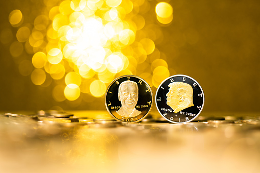 Fujian, China - December 28, 2021: Coins with Donald Trump and Joseph Biden.Donald Trump and Joseph Biden were the 45th and 46th presidents of the United States, respectively