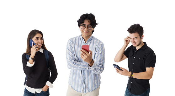Three young latin people standing using the mobile phones.