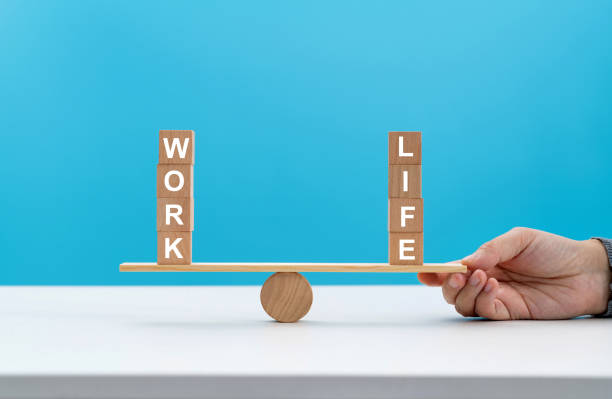 istock Wooden seesaw with word life and work 1415217140