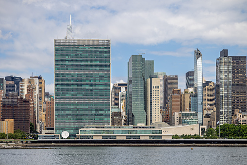 Long Island City, Queens, New York, NY, USA - July 7th 2022: View across East River to the Manhattan skyline and the UN building