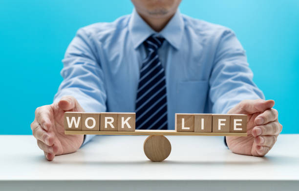 istock Wooden seesaw with word life and work 1415217351