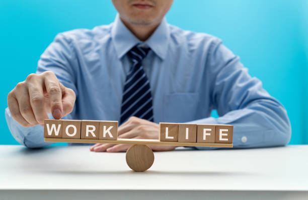 istock Wooden seesaw with word life and work 1415217437