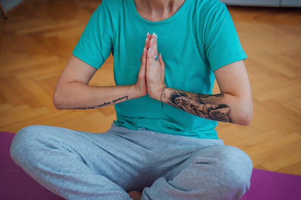 istock Woman practicing yoga from home 1415217572
