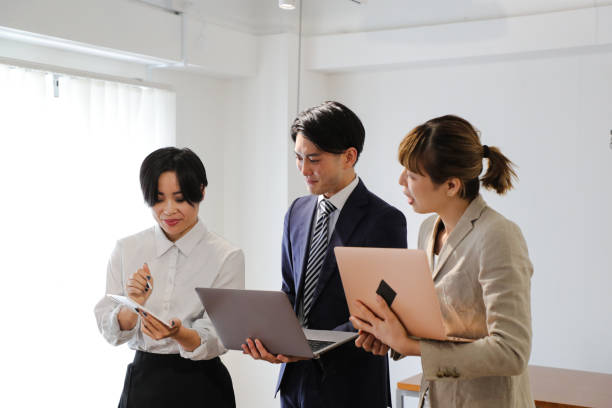 istock Asian entrepreneurs reviewing business data on laptop 1415217828