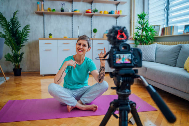 istock Woman live streaming about exercising 1415217864