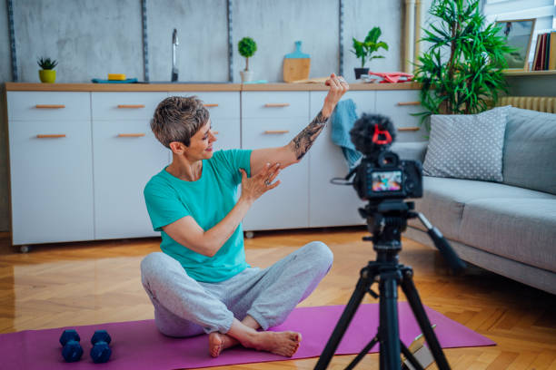 istock Woman live streaming about exercising 1415219171