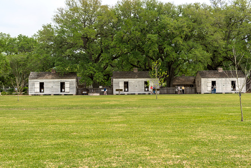 Oak Alley Plantation, Louisiana - April 09, 2016: Oak Alley Plantation in Louisiana. House of Slaves in Background.