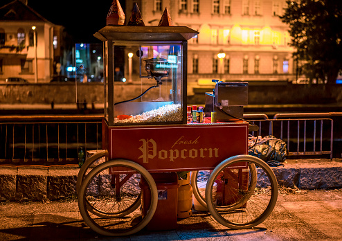 Old fashioned popcorn machine on the promenade in the evening