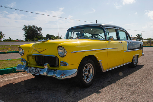 Havana, Cuba - August 3, 2022: Vintage taxi waiting for clients on hot summer day in Havana, capital city of Cuba